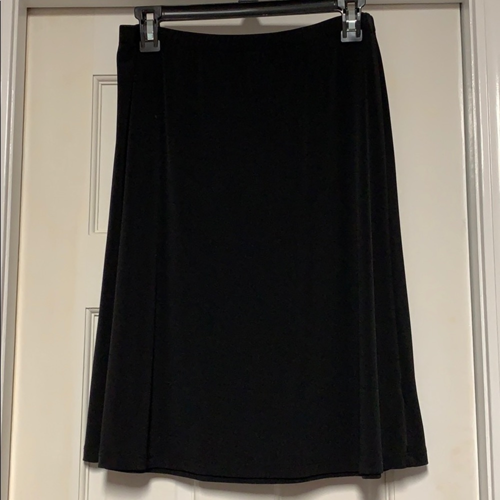 Black skirt. Knee length